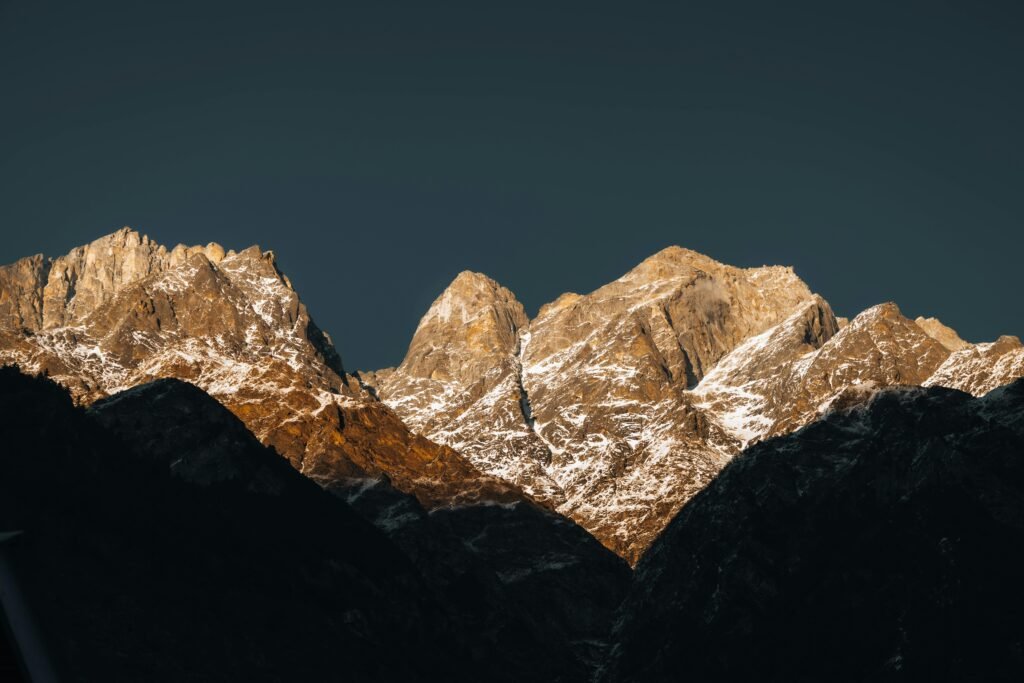Stunning view of the Himalayan mountain peaks illuminated by sunrise. Perfect for nature and travel photography.