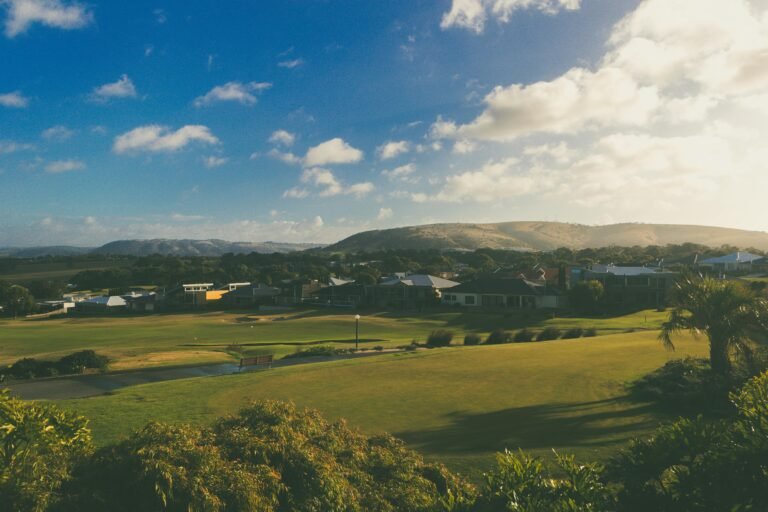 Captivating landscape of lush green countryside in McCracken, South Australia under a beautiful summer sky.