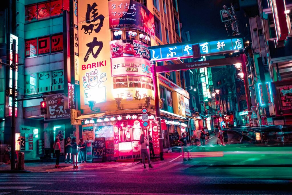 Explore the vivid neon lights and bustling nightlife of Shibuya, Tokyo, capturing urban life and architecture.